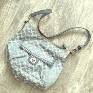 Medium sized, light blue authentic COACH purse.